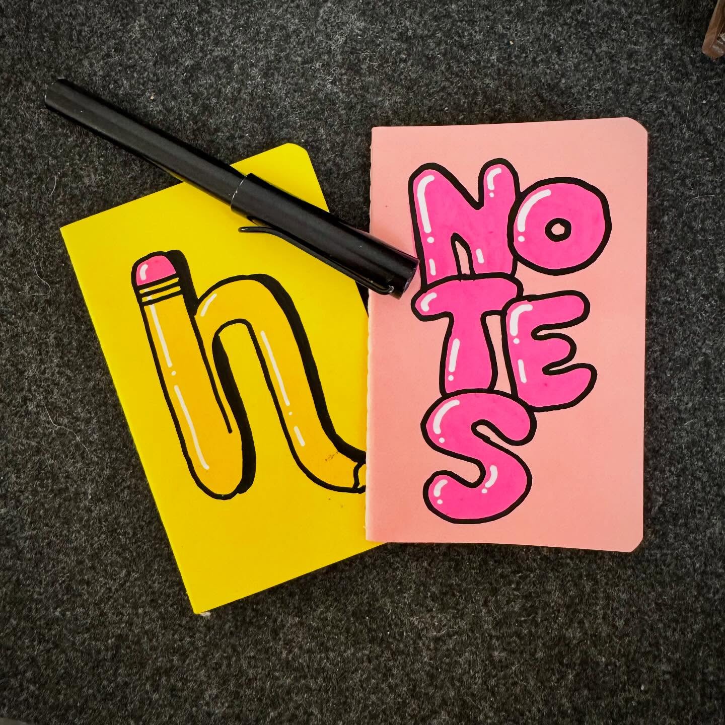 Pocket notebooks with drawings in the covers